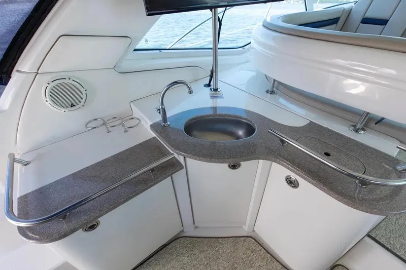 Slide: The Image of Luxurious 2006 Sea Ray 48 Sundancer yacht interior with sleek kitchenette and modern amenities. - 19
