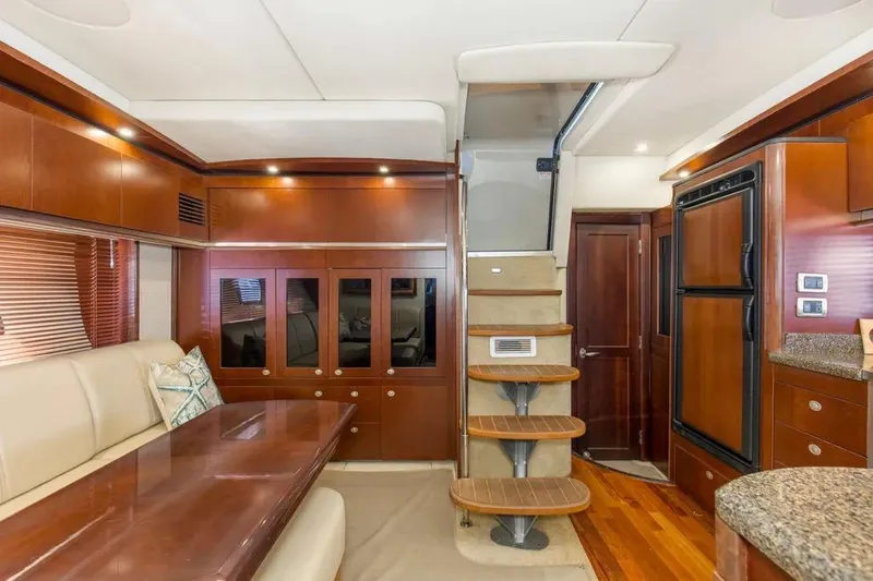 Slide: The Image of Luxurious interior of 2006 Sea Ray 48 Sundancer yacht with elegant wood finishes and modern amenities. - 23