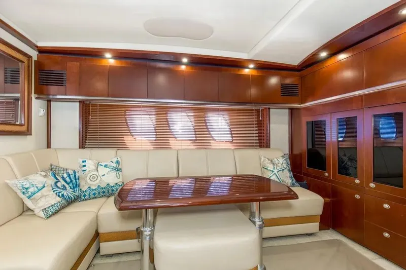Slide: The Image of Luxurious interior of 2006 Sea Ray 48 Sundancer yacht with elegant seating and wooden finishes. - 24