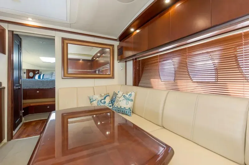 Slide: The Image of Luxurious interior of 2006 Sea Ray 48 Sundancer yacht with elegant seating and decor. - 25