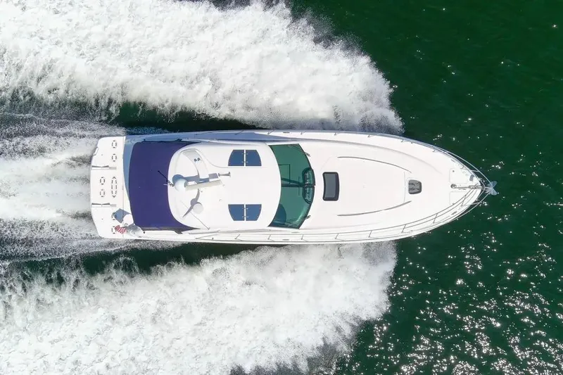 Slide: The Image of Aerial view of 2006 Sea Ray 48 Sundancer yacht cruising on open water. - 3