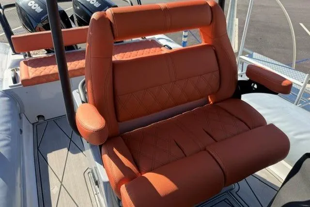 Slide: The Image of 2023 Fluid Watercraft M35 boat with luxurious orange seating and modern design. - 3