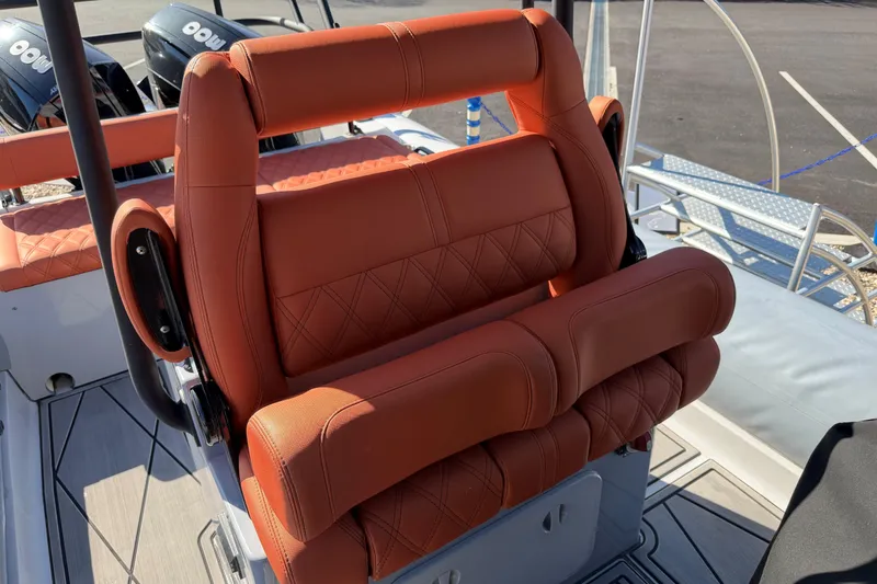 Slide: The Image of Luxurious seating on 2023 Fluid Watercraft M35 boat, featuring premium leather upholstery. - 4