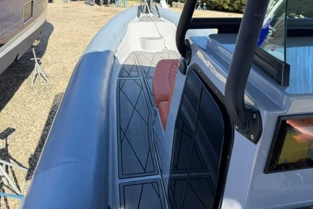 Slide: The Image of 2023 Fluid Watercraft M35 boat deck with modern design and seating. - 8