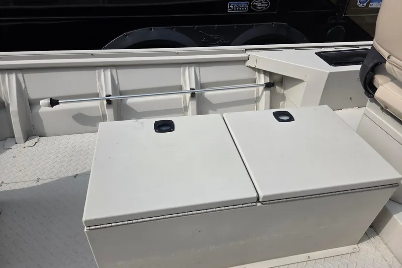 Slide: The Image of 2011 Sea-Ark Rebel 15 boat interior with storage compartments and seating. - 5