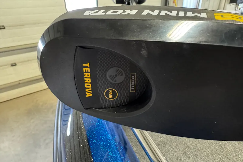 Slide: The Image of Minn Kota Terrova motor on 2026 Nitro ZV19 Sport boat in a garage setting. - 10