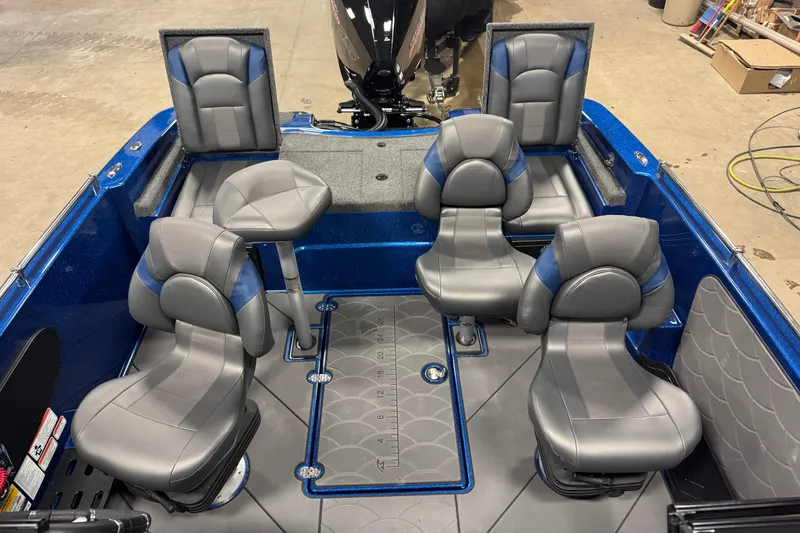 Slide: The Image of Interior of 2026 Nitro ZV19 Sport boat with gray and blue seating. - 13