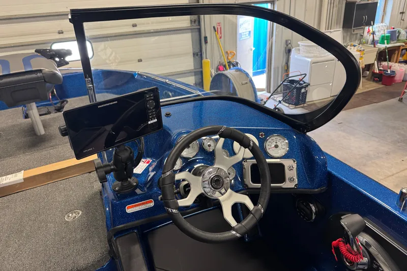 Slide: The Image of Interior of 2026 Nitro ZV19 Sport boat with steering wheel and navigation display. - 14