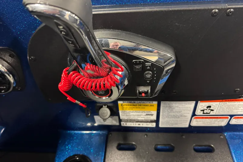 Slide: The Image of Control panel of 2026 Nitro ZV19 Sport boat with throttle and safety features. - 17