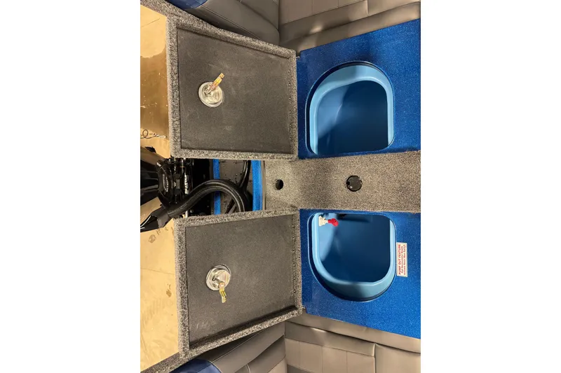 Slide: The Image of 2026 Nitro ZV19 Sport boat interior with storage compartments and blue accents. - 18