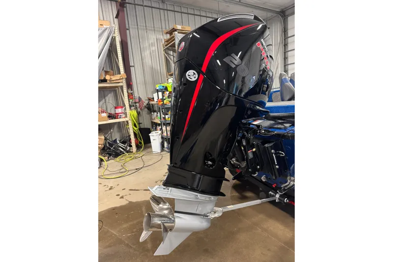 Slide: The Image of Outboard motor on a 2026 Nitro ZV19 Sport boat in a garage setting. - 4