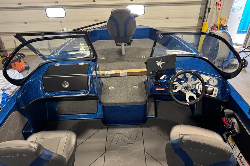 Slide: The Image of Interior of a 2026 Nitro ZV19 Sport boat, featuring steering wheel and dashboard controls. - 5