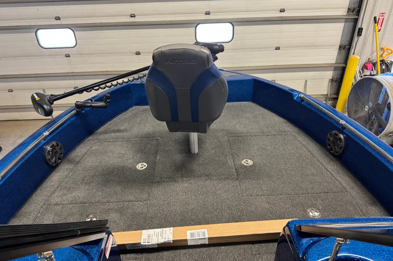 Slide: The Image of 2026 Nitro ZV19 Sport boat interior with blue seating and carpeted deck. - 8