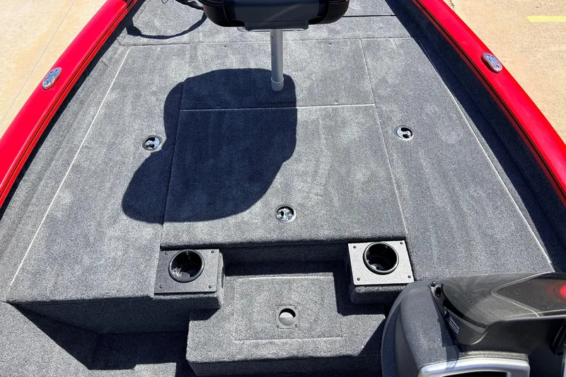 Slide: The Image of 2026 Tracker Pro Team 175 boat deck with gray carpet and cup holders. - 12