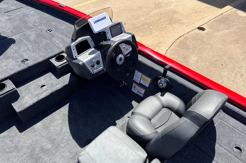 Slide: The Image of 2026 Tracker Pro Team 175 boat interior with steering console and seating. - 22