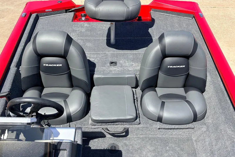 Slide: The Image of 2026 Tracker Pro Team 175 boat interior with gray seats and red accents. - 23