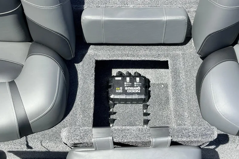 Slide: The Image of Interior of 2026 Tracker Pro Team 175 boat with NOCO Genius battery charger. - 24