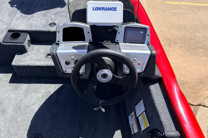 Slide: The Image of 2026 Tracker Pro Team 175 boat dashboard with steering wheel and Lowrance electronics. - 25