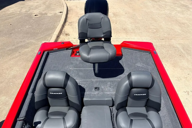 Slide: The Image of 2026 Tracker Pro Team 175 boat interior with gray seats and red trim. - 27