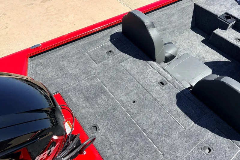Slide: The Image of 2026 Tracker Pro Team 175 boat interior with gray carpet and seating. - 35