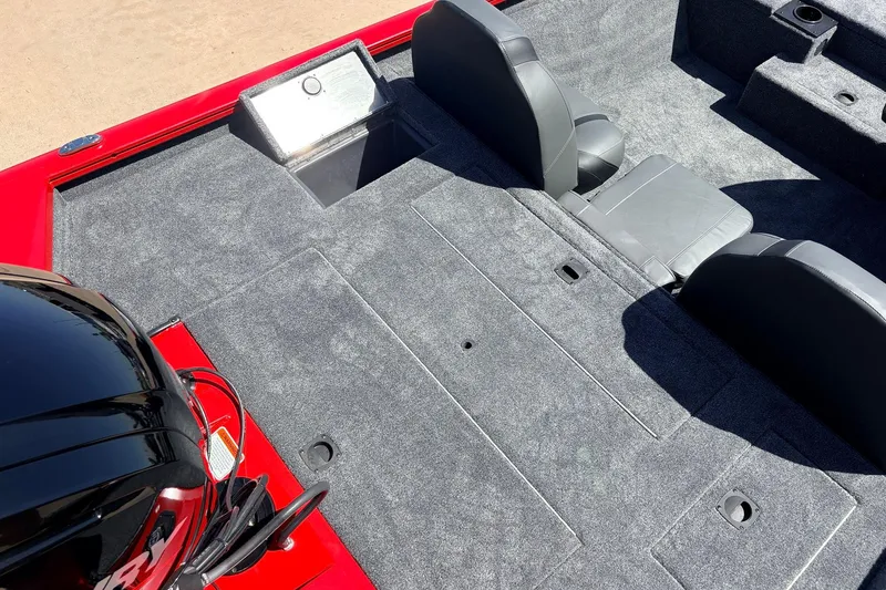 Slide: The Image of 2026 Tracker Pro Team 175 boat interior with gray carpet and seating. - 36