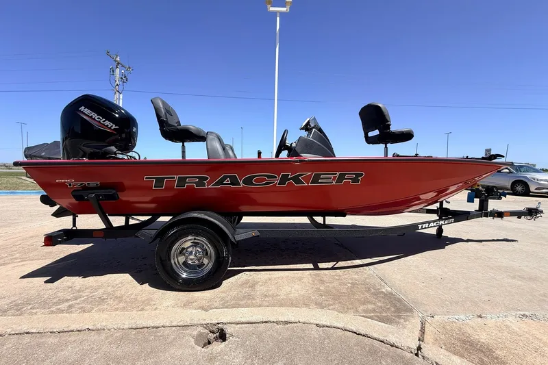 Slide: The Image of 2026 Tracker Pro Team 175 boat on trailer, red exterior, parked outdoors. - 4