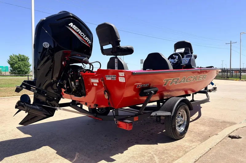 Slide: The Image of 2026 Tracker Pro Team 175 boat with Mercury engine on trailer, parked outdoors. - 5