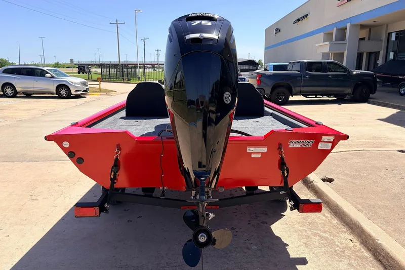 Slide: The Image of 2026 Tracker Pro Team 175 boat with Mercury engine, parked outdoors. - 6