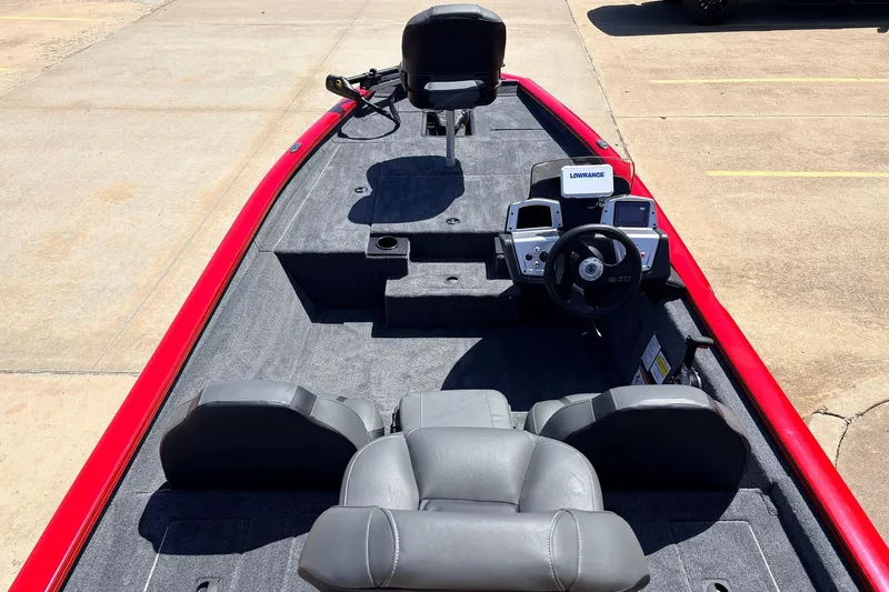 Slide: The Image of 2026 Tracker Pro Team 175 boat interior with steering console and seating. - 8