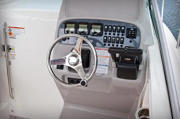 Slide: The Image of Manufacturer Provided Image: 2014 Robalo R265 Walkaround boat helm with steering wheel and control panel. - 16