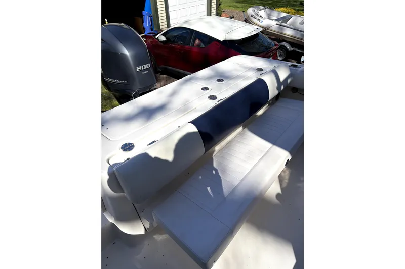 Slide: The Image of 2014 Robalo R265 Walkaround boat interior with seating and Yamaha 200 engine. - 8