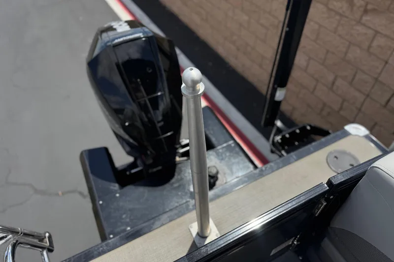 Slide: The Image of 2024 Regency 230 DL3 boat with outboard motor and deck details. - 22