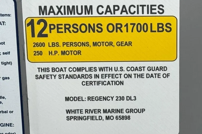 Slide: The Image of 2024 Regency 230 DL3 capacity label: 12 persons or 1700 lbs, 250 HP motor. - 32