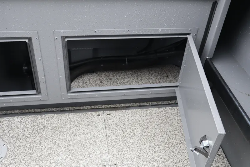Slide: The Image of Open storage compartment on 2026 Alumaweld Horizon 24 boat, showcasing interior details. - 12