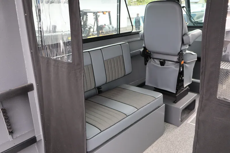 Slide: The Image of Interior of 2026 Alumaweld Horizon 24 boat with gray seating and modern design. - 16