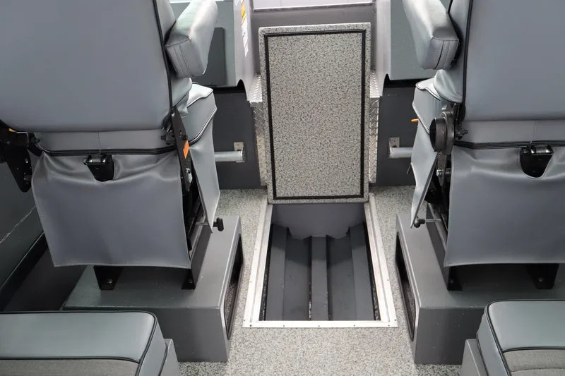 Slide: The Image of Interior of 2026 Alumaweld Horizon 24 boat with gray seating and storage compartments. - 17