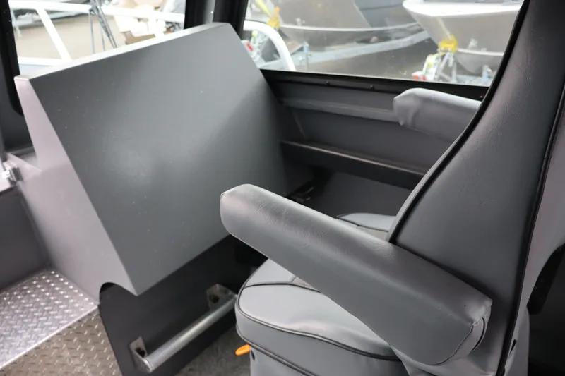 Slide: The Image of Interior of 2026 Alumaweld Horizon 24 boat, featuring a comfortable captain's chair. - 20