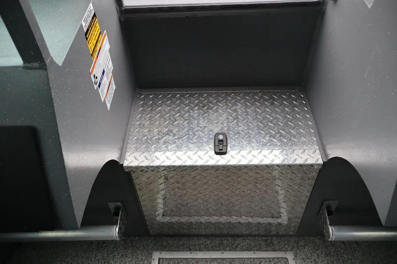 Slide: The Image of Alumaweld Horizon 24 boat interior, featuring diamond plate step and safety labels, 2026 model. - 21