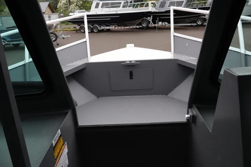 Slide: The Image of 2026 Alumaweld Horizon 24 boat interior, showcasing bow area and deck details. - 22
