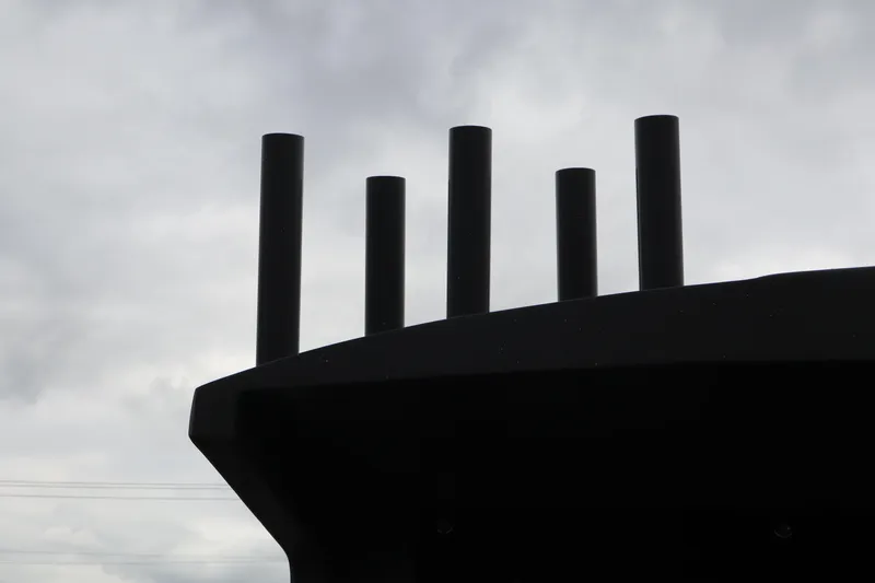 Slide: The Image of Silhouette of Alumaweld Horizon 24 boat rods against cloudy sky, 2026 model. - 25