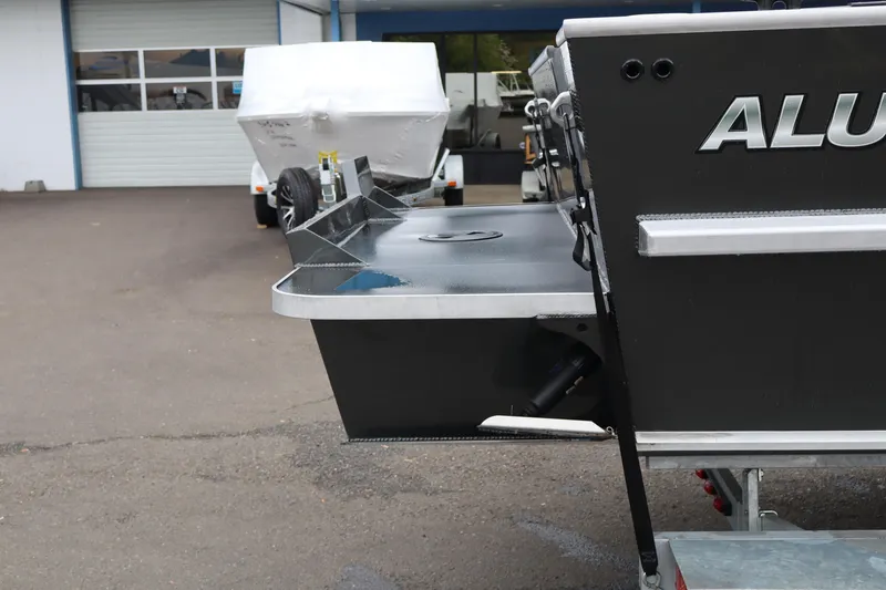 Slide: The Image of 2026 Alumaweld Horizon 24 boat rear view in a parking lot. - 4