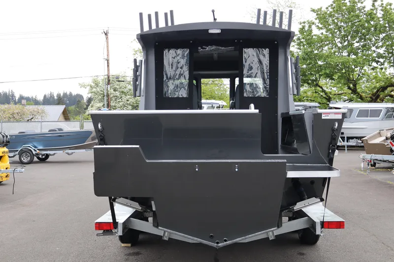 Slide: The Image of 2026 Alumaweld Horizon 24 boat, rear view, parked on trailer in outdoor setting. - 5
