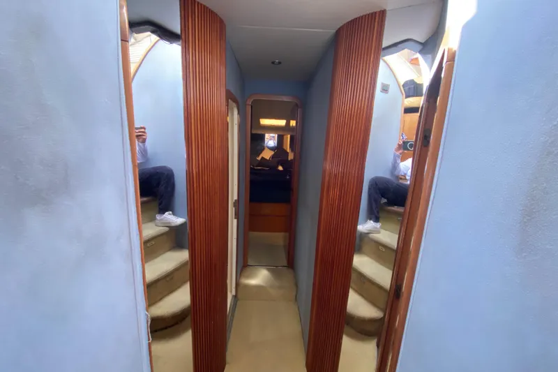 Slide: The Image of Interior hallway of a 1998 Azimut 52 yacht with wooden accents and stairs. - 35