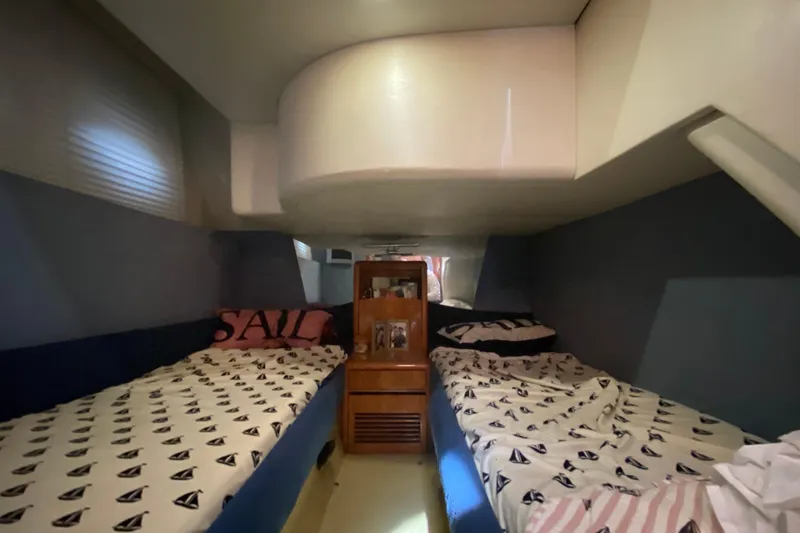Slide: The Image of Interior cabin of a 1998 Azimut 52 yacht with twin beds and nautical decor. - 39