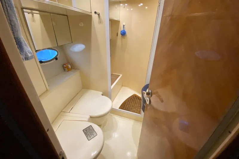 Slide: The Image of Bathroom interior of 1998 Azimut 52 yacht, featuring shower and toilet. - 42