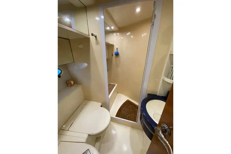 Slide: The Image of Bathroom interior of 1998 Azimut 52 yacht, featuring shower and toilet. - 43