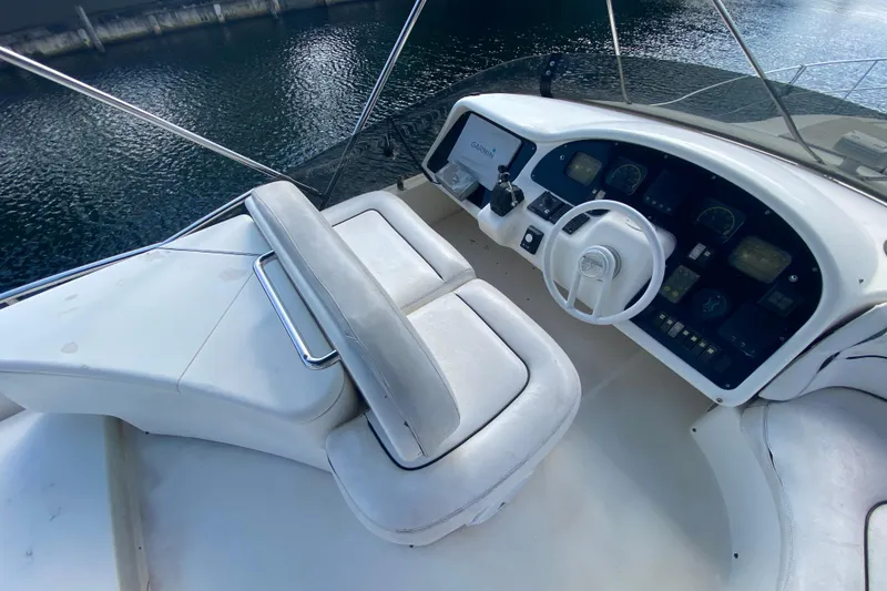 Slide: The Image of Cockpit of 1998 Azimut 52 yacht with steering wheel and control panel. - 48