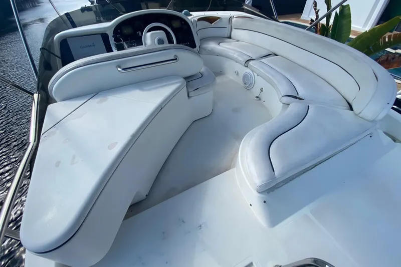 Slide: The Image of Luxurious 1998 Azimut 52 yacht interior with white leather seating and modern dashboard. - 50