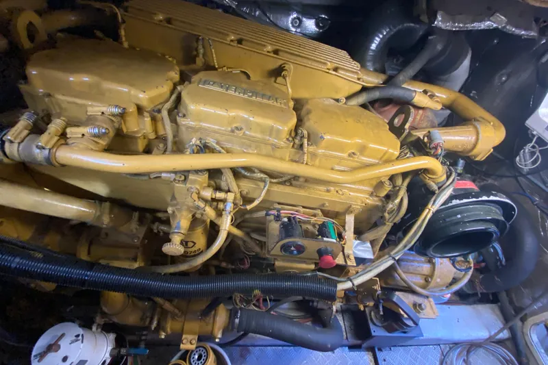 Slide: The Image of Engine of a 1998 Azimut 52 yacht, showcasing intricate mechanical components. - 56