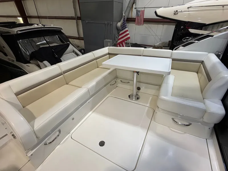 Slide: The Image of Interior of a 2015 Sea Ray Sundancer 510 yacht with seating area and table. - 10